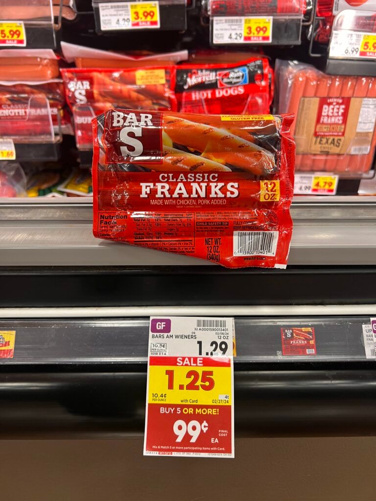 A package of franks on a shelf in a grocery store.
