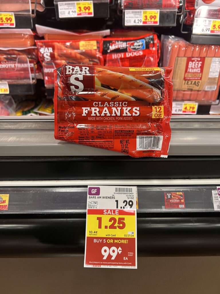 A package of franks on a shelf in a grocery store.